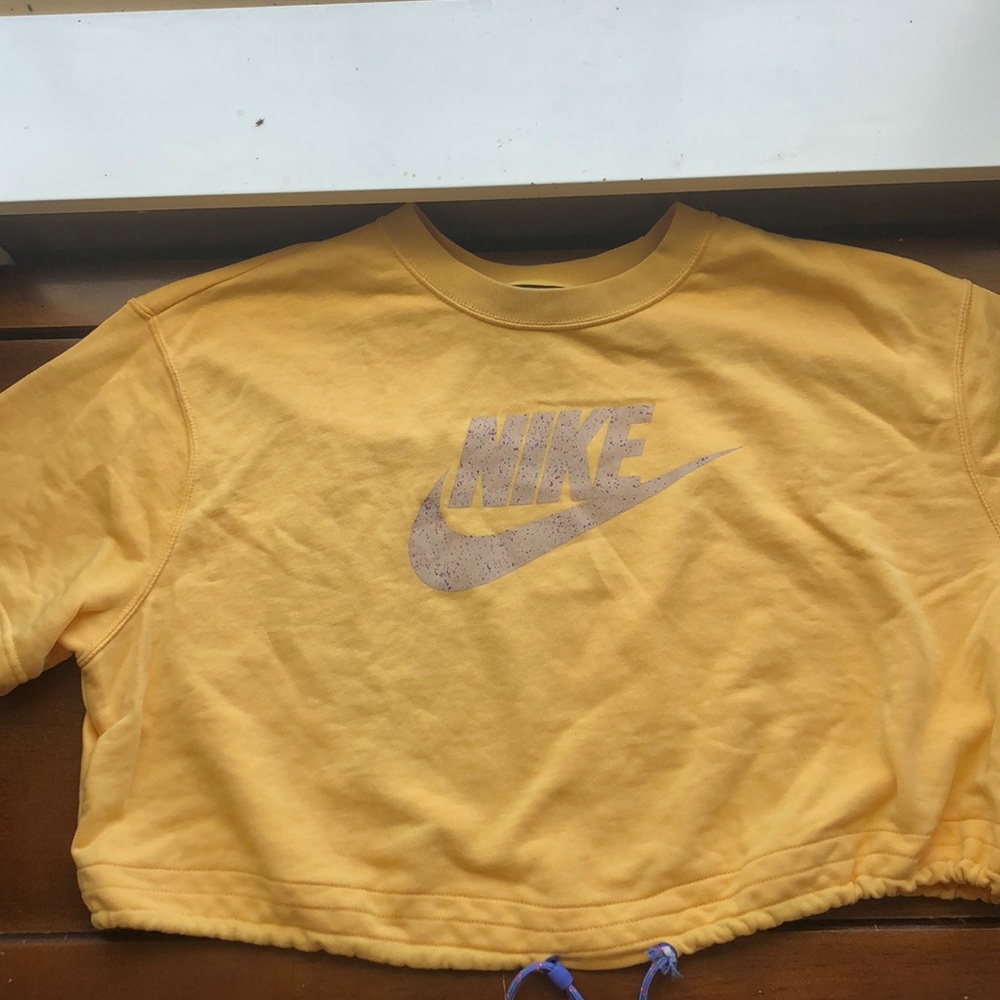 Nike cropped drawstring yellow shirt with Nike symbol and swoosh